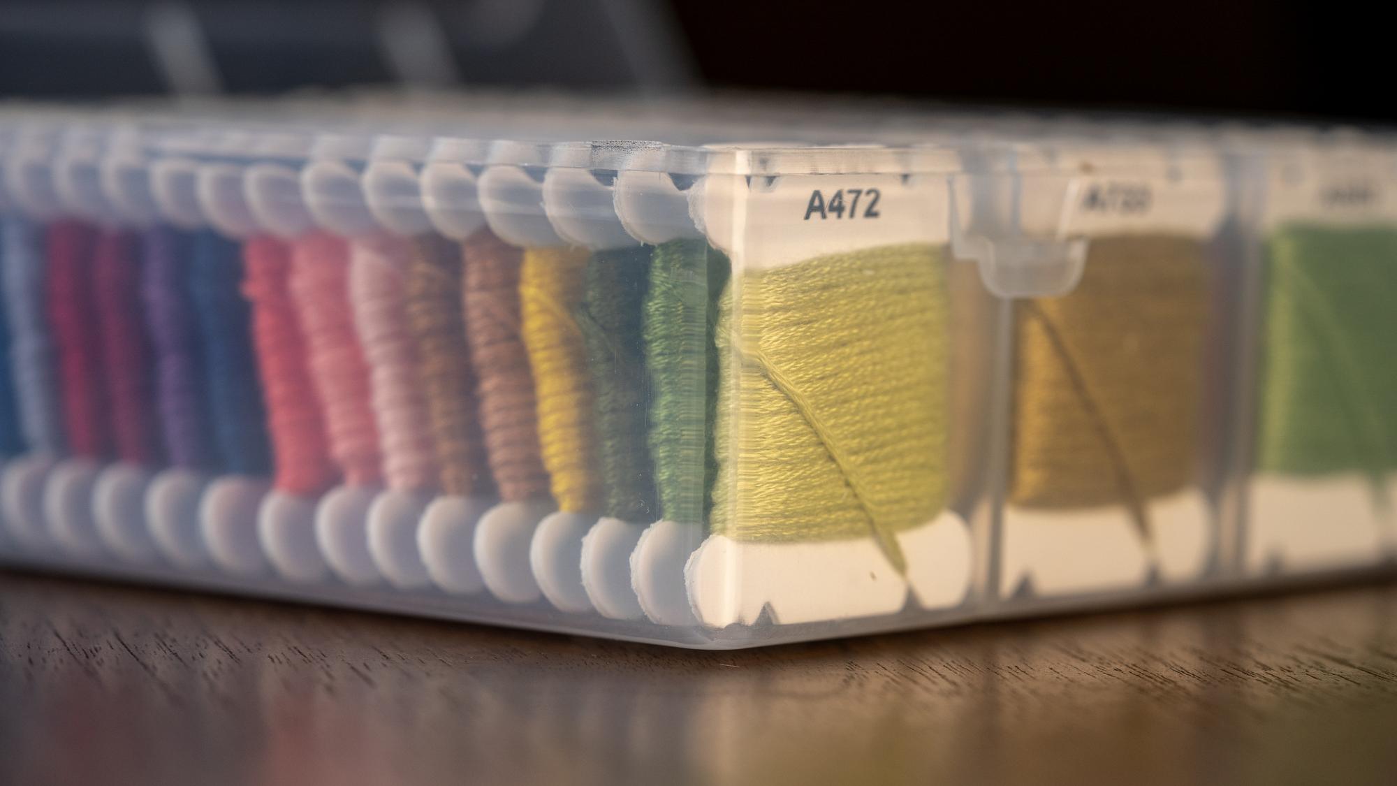 embroidery samples laid out on table