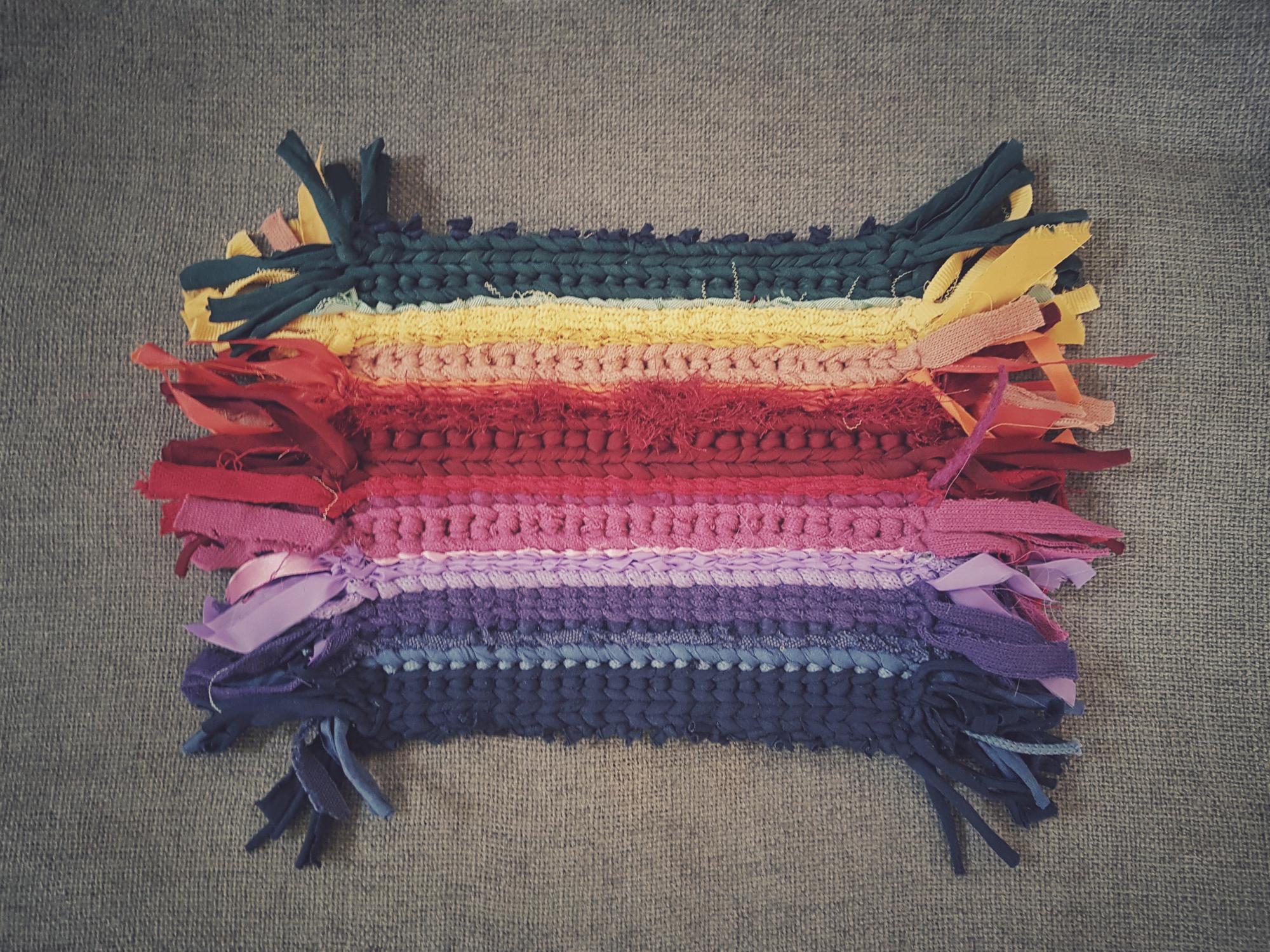 assorted embroidered swatches on textured paper